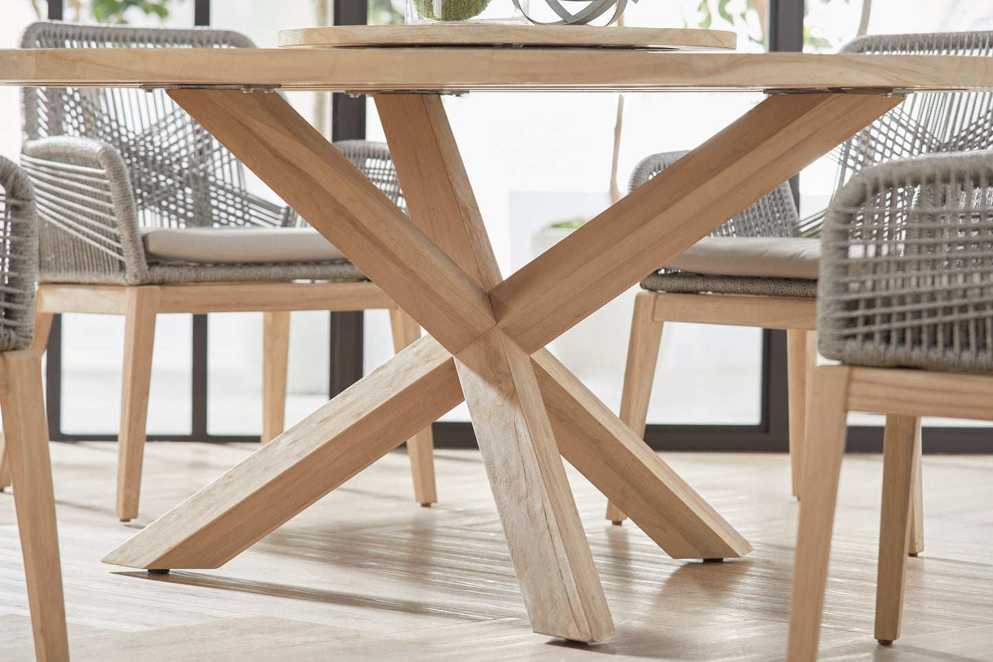 Boca Outdoor Round Dining Table, 63", natural solid teak wood with a unique X-base design.