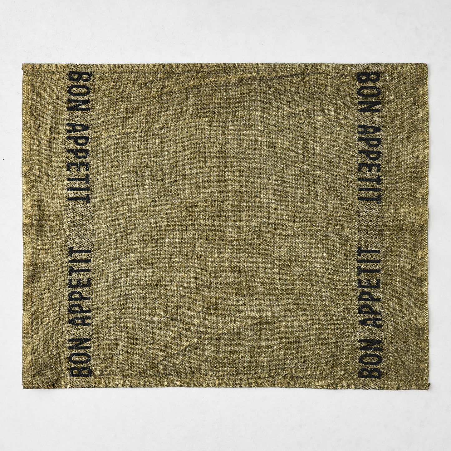 Avocat green linen napkin with "BON APPETIT" in black lettering, 14"L x 18"W.