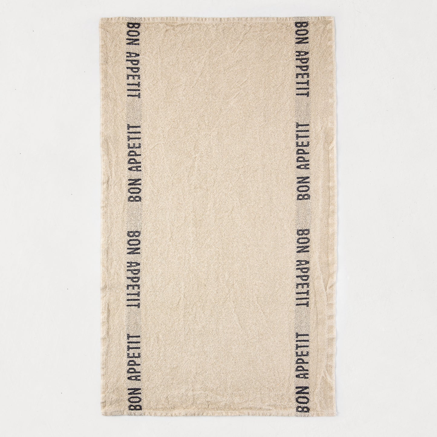 Khaki linen hand towel with "BON APPETIT" printed vertically in black on both sides.