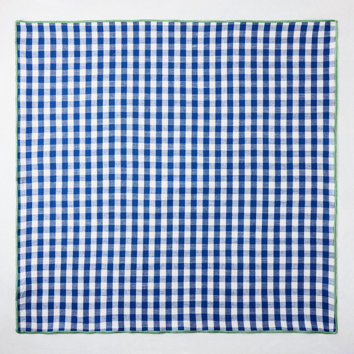 Chatham Blue Gingham Cotton Napkin, 22" square, with green embroidered trim.
