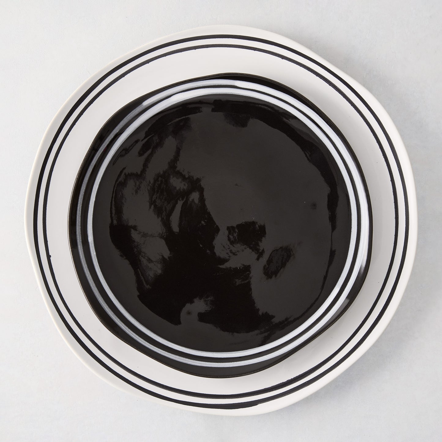 Diane Keaton + Hudson Grace Draft Collection black stoneware salad plate with white double stripe.