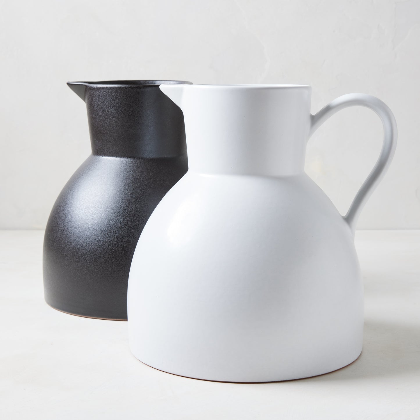 Diane Keaton + Hudson Grace sculptural black and white stoneware pitchers.