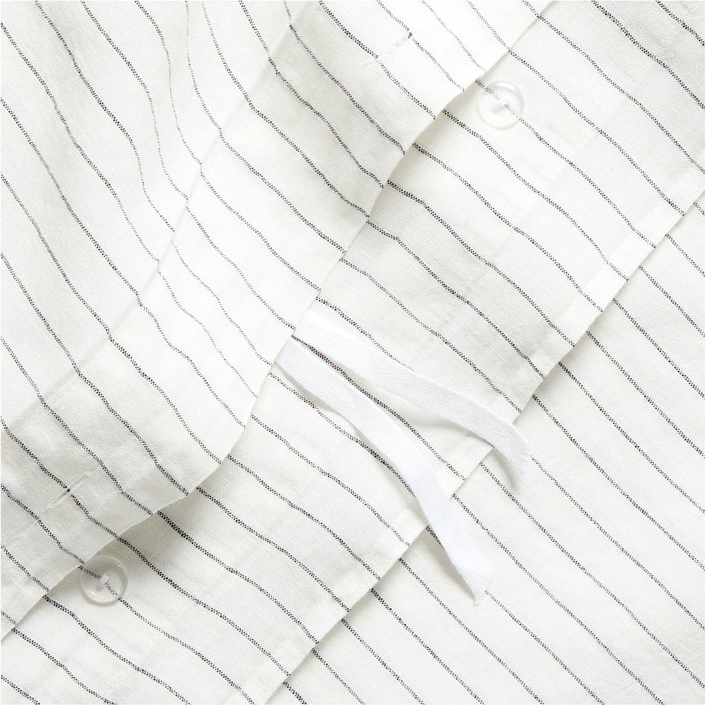 Diane Keaton + Hudson Grace Shirting Stripe Linen Duvet Cover, white with thin black stripes, button closure.