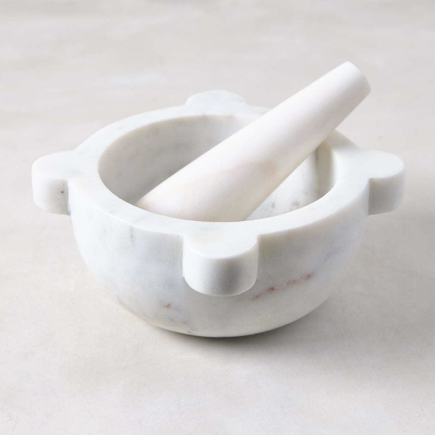 Diane Keaton + Hudson Grace white marble mortar and pestle with natural variations.