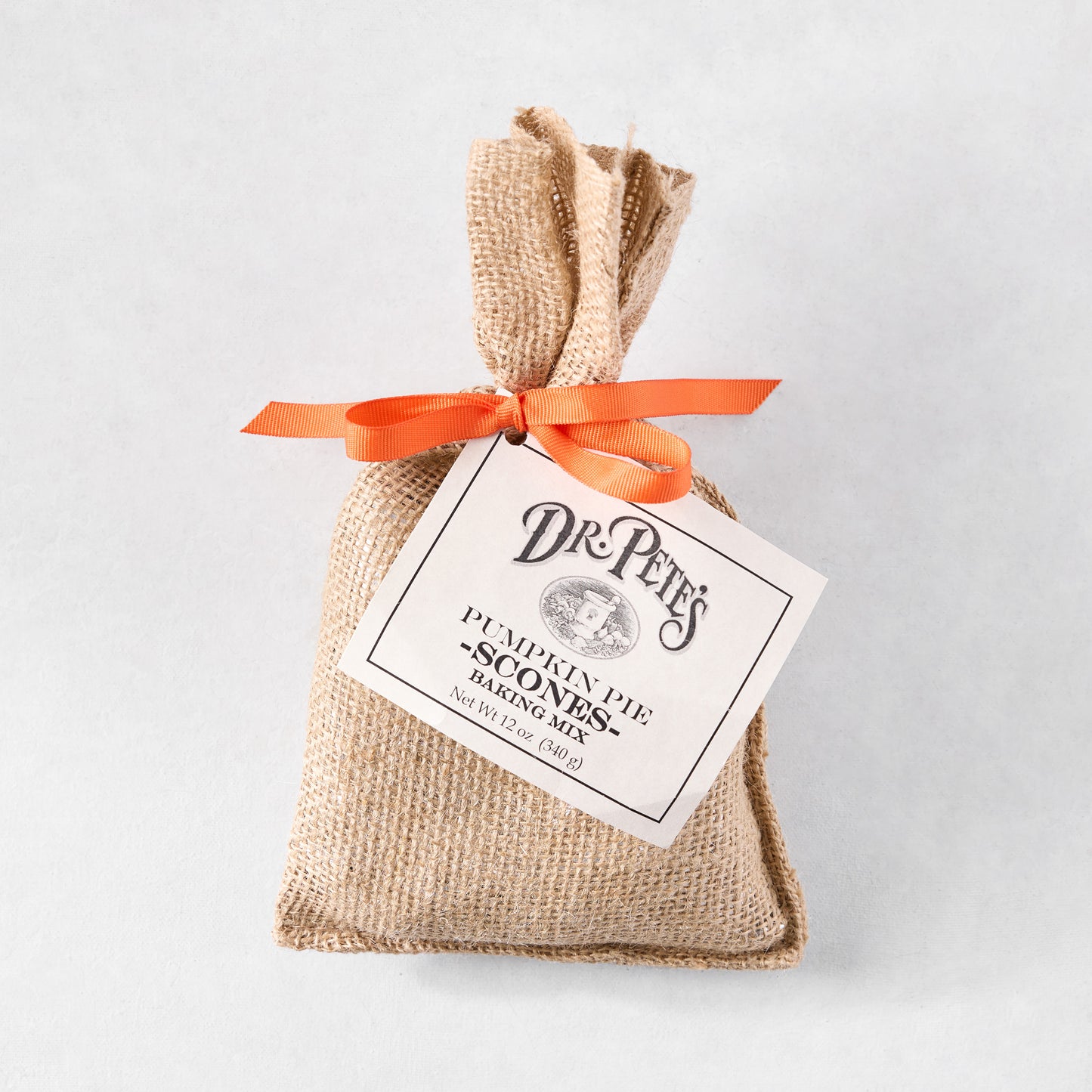Dr. Pete's Pumpkin Pie Scones Baking Mix in a burlap bag with an orange ribbon and tag.