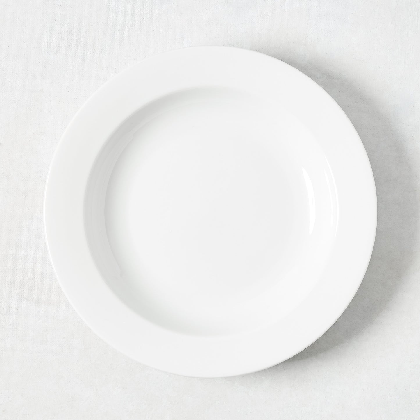 Hudson Grace Everyday Porcelain Bowl, classic white, 9.3" Dia, with a wide rim.