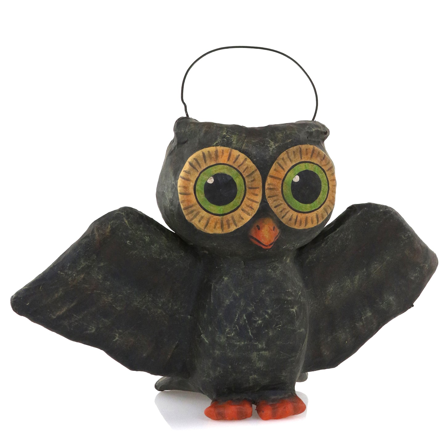 Handcrafted black papier-mâché owl Halloween candy bucket with large green eyes and wire handle, 10.5 inches wide.