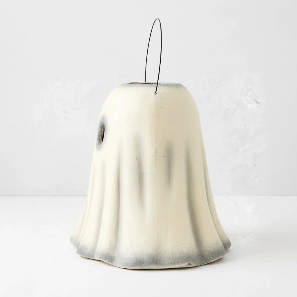 Hudson Grace vintage-style ghost candy bucket made of distressed white papier-mâché with a wire handle.
