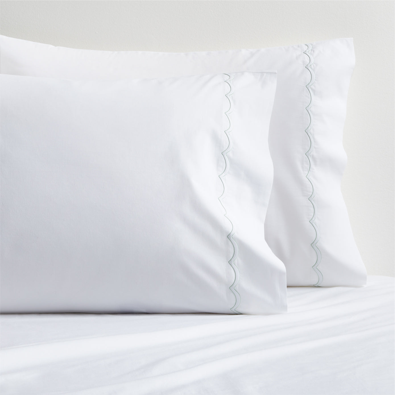 White percale pillowcases with green scallop stitch trim, set of 2.