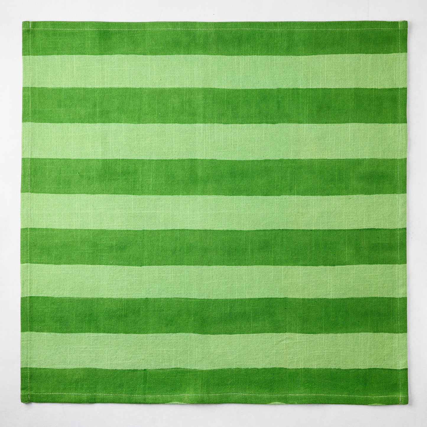 Green Tonal Hampton Stripe Cotton Napkin, 22" square, with bold two-toned green horizontal stripes.