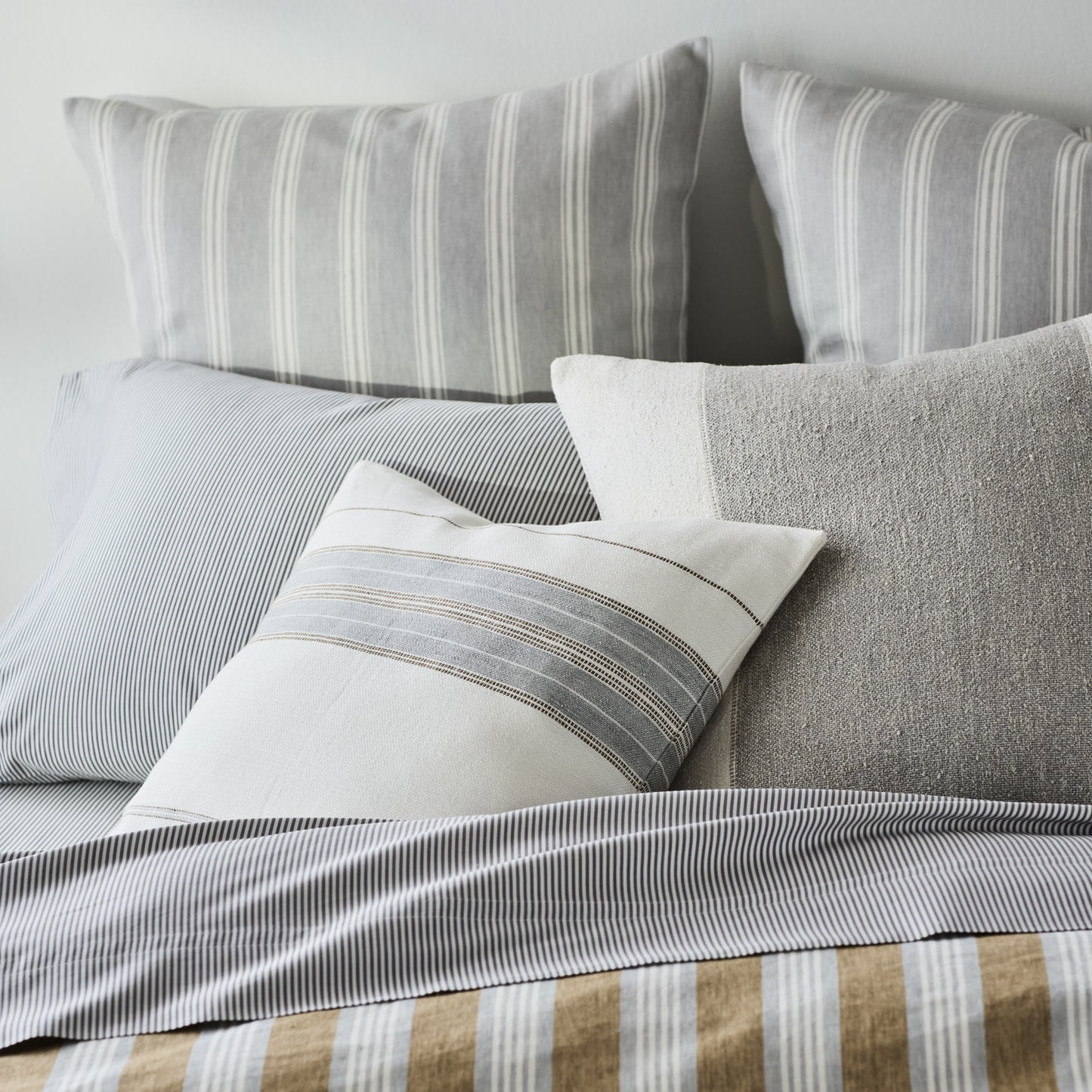 Guest House Stripe Linen Pillow Sham in oyster and light grey stripes, made of Belgian flax linen.