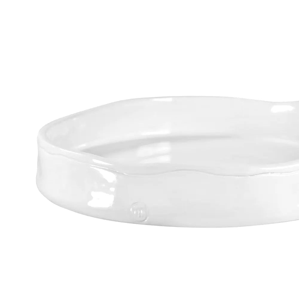 Handmade creamy white ceramic tray by Montes Doggett, 11" round with a 2" high wavy rim.