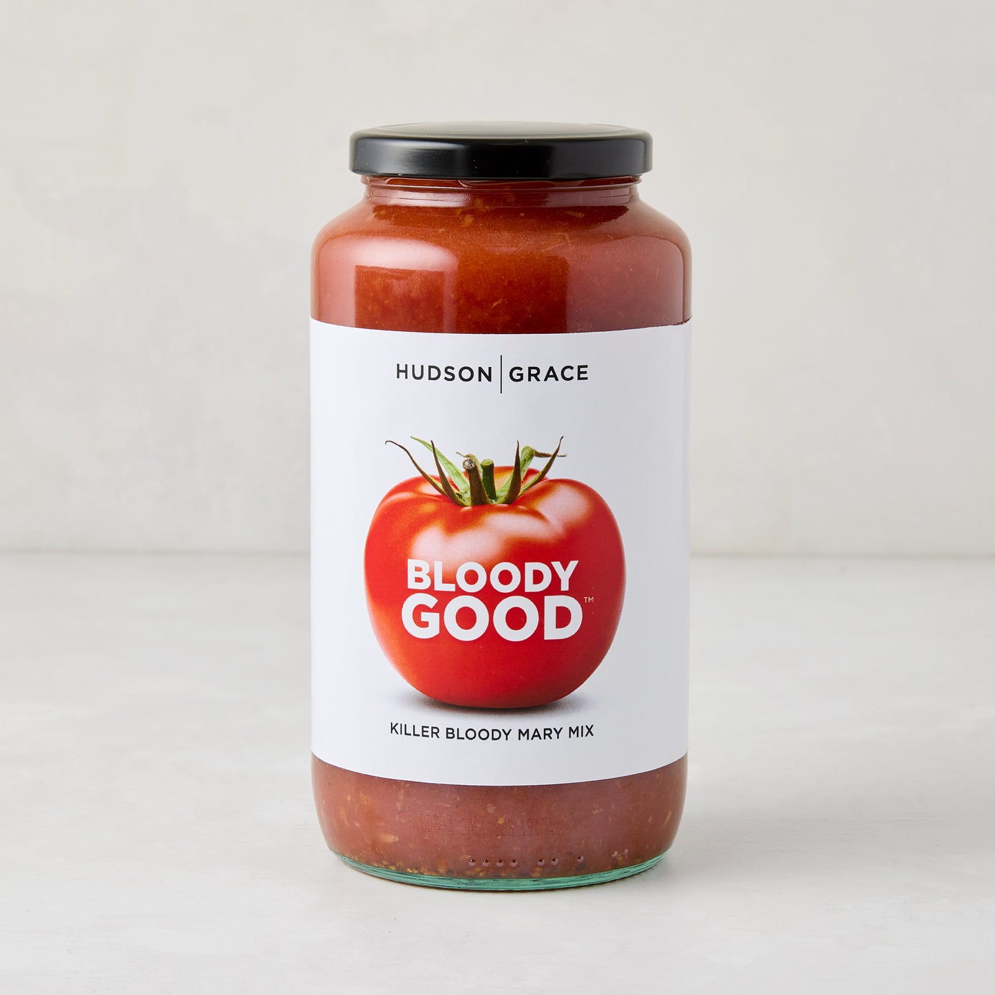 Hudson Grace Bloody Good Killer Bloody Mary Mix in a clear glass jar with a black lid.