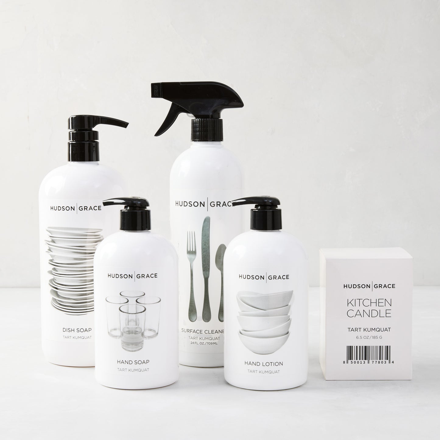 White Hudson Grace Tart Kumquat cleaning gift set: dish soap, hand soap, hand lotion, surface cleaner, and kitchen candle.