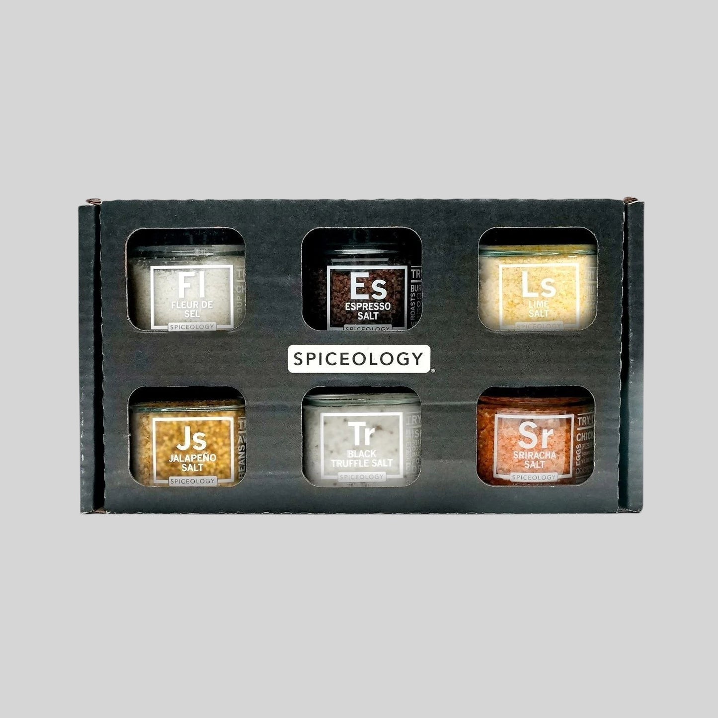 Hudson Grace Spiceology Infused Salt Variety Pack featuring six unique gourmet seasoning jars in a black gift box.