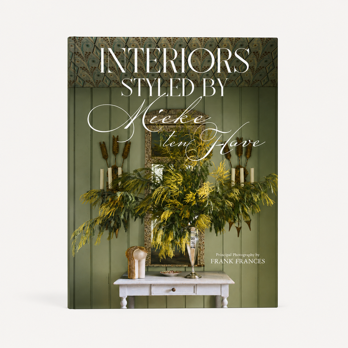 Interiors: Styled by Mieke ten Have hardcover book featuring a green interior scene with yellow flowers and a white table.