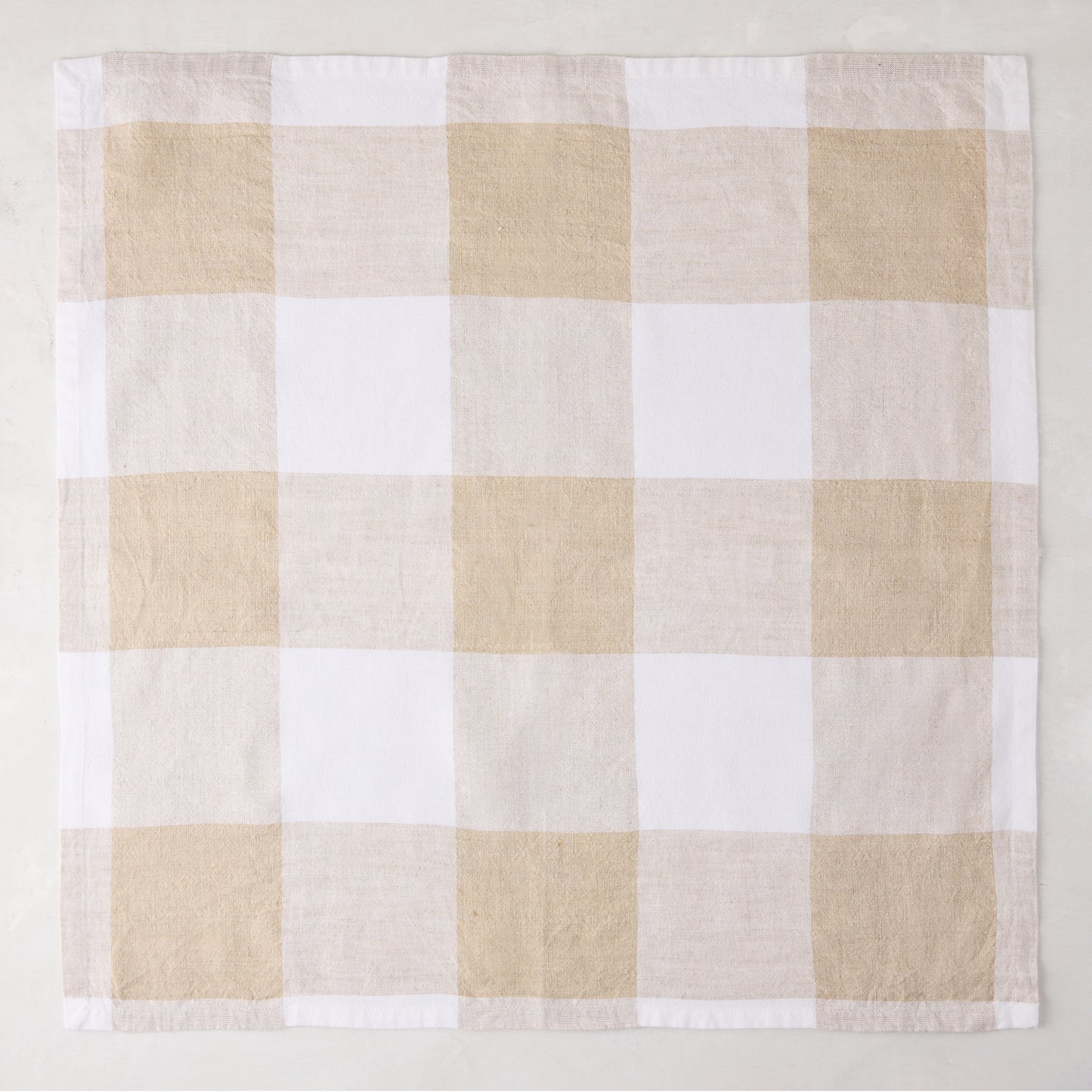 Khaki buffalo check linen napkin, 20" x 20", folded square.