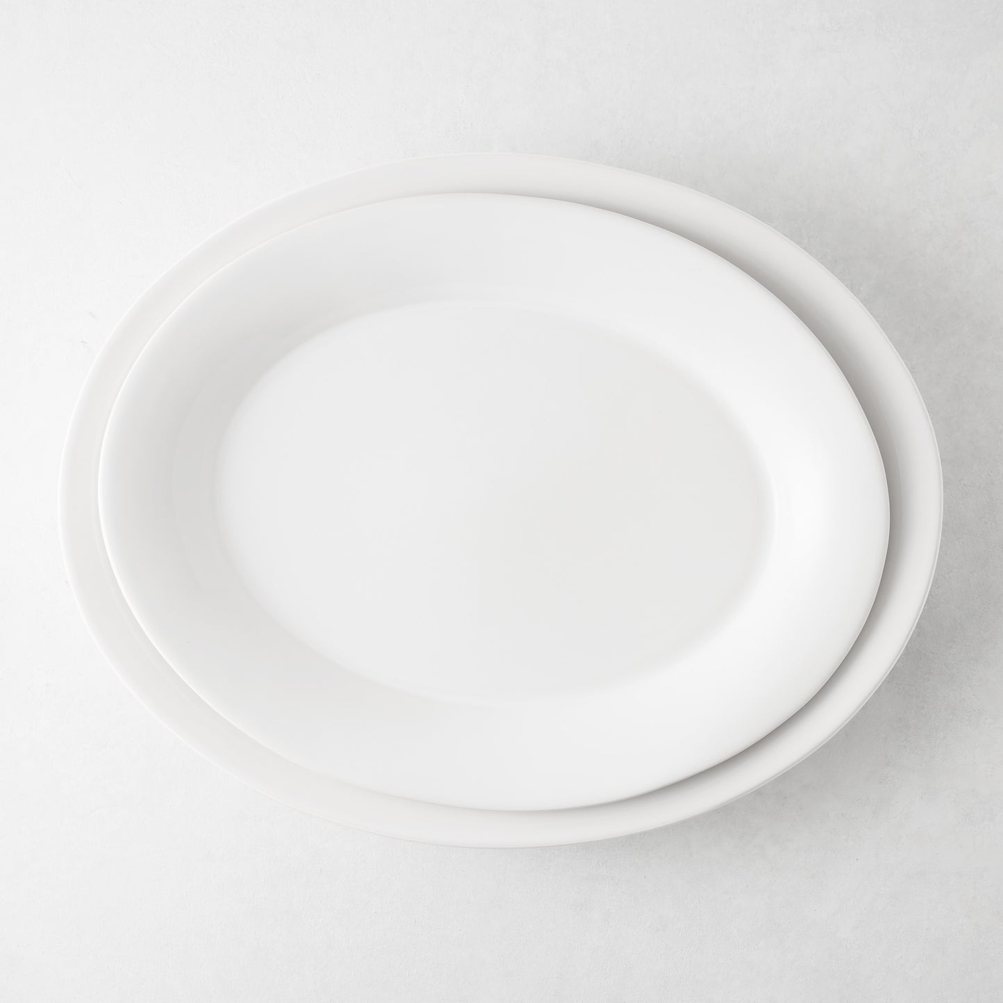 Lagos Large Ceramic Serving Platter, white glaze, oval, 18"L x 14"W, slightly raised edge.