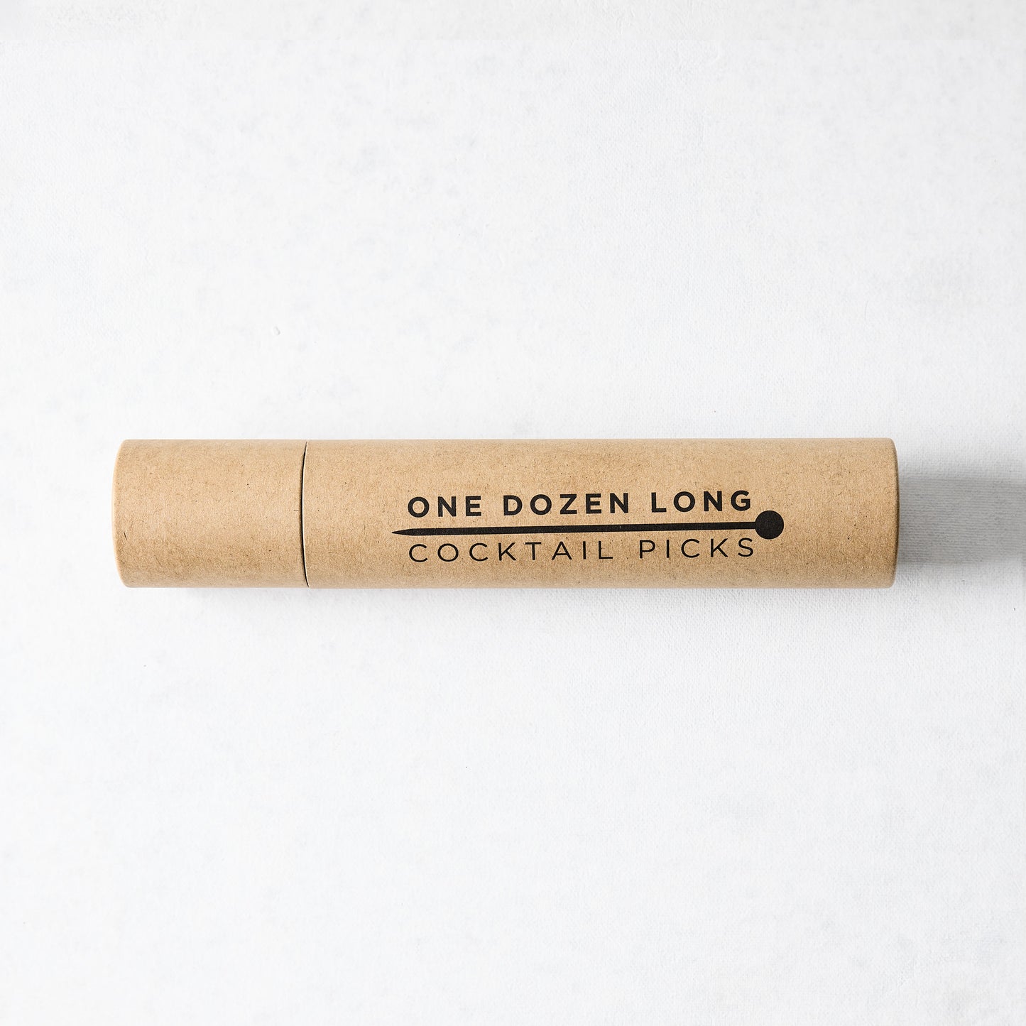 Kraft paper tube with "ONE DOZEN LONG COCKTAIL PICKS" in black text and a ball-top pick icon.