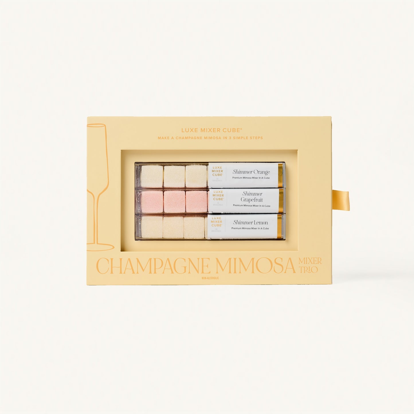 Luxe Champagne Mimosa Mixer Cube Trio: 18 shimmering orange, grapefruit, and lemon flavored cubes in a beige box.