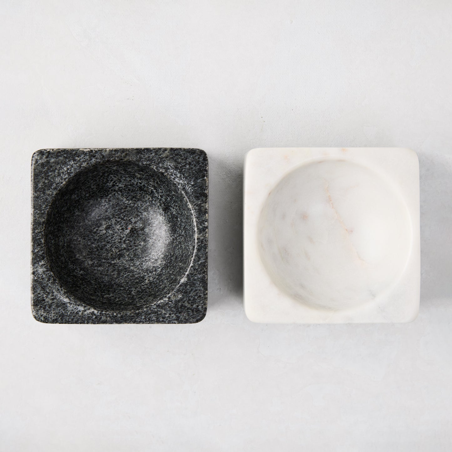 Black and white marble square pinch bowls, 3" square, with round interiors.