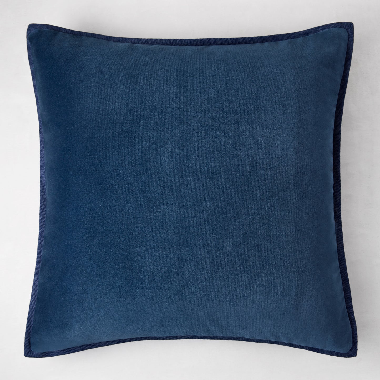 Navy blue velvet square reversible pillow with linen trim, 22" square.