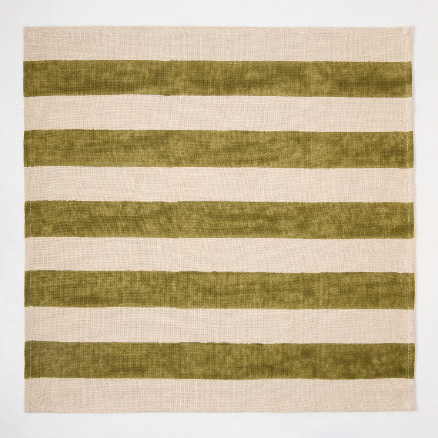 Olive green Hampton stripe natural cotton napkin, 22" square, with wide block-printed green stripes on khaki.