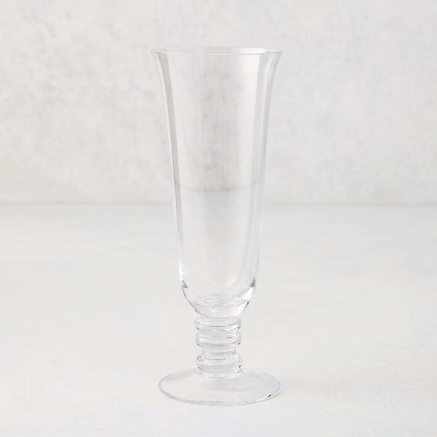 Palermo Stem Champagne Flute, clear hand-blown glass with curved lip and artistic ribbed stem.