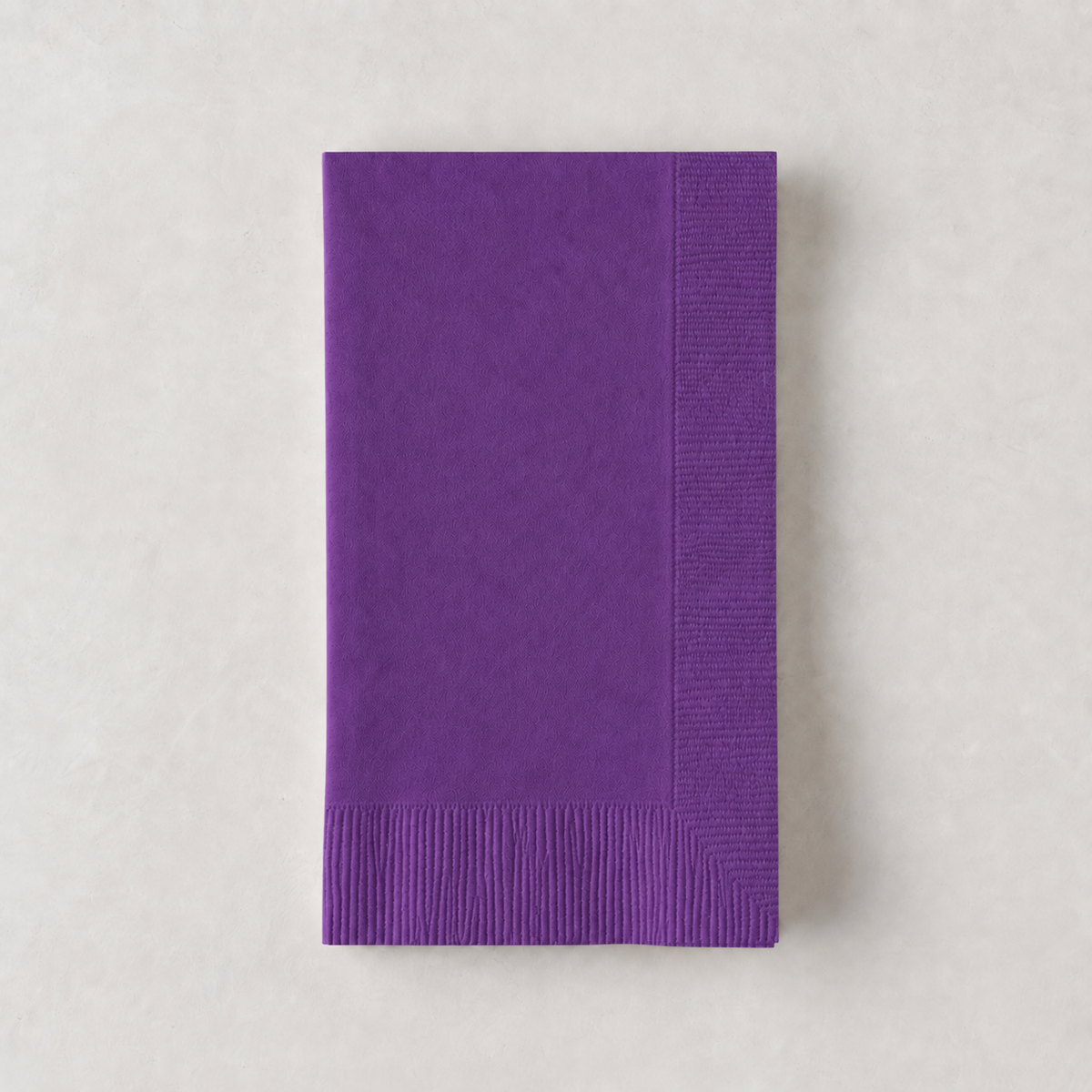 Dark purple 3-ply disposable paper hand towel with a textured border on a light background.
