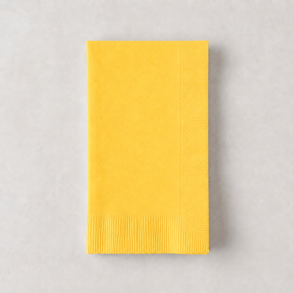 Folded bright yellow 3-ply paper hand towel with a textured border, 8 by 4.5 inches.