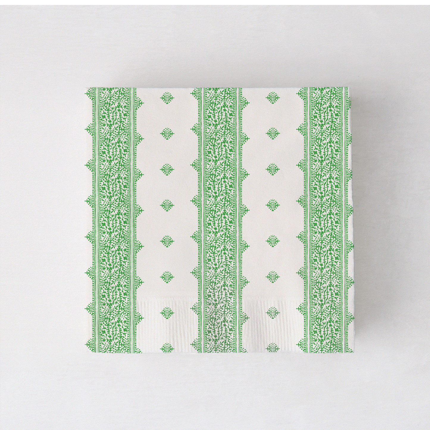 Peter Dunham + Hudson Grace Fez cocktail napkins, white with green intricate stripe pattern.