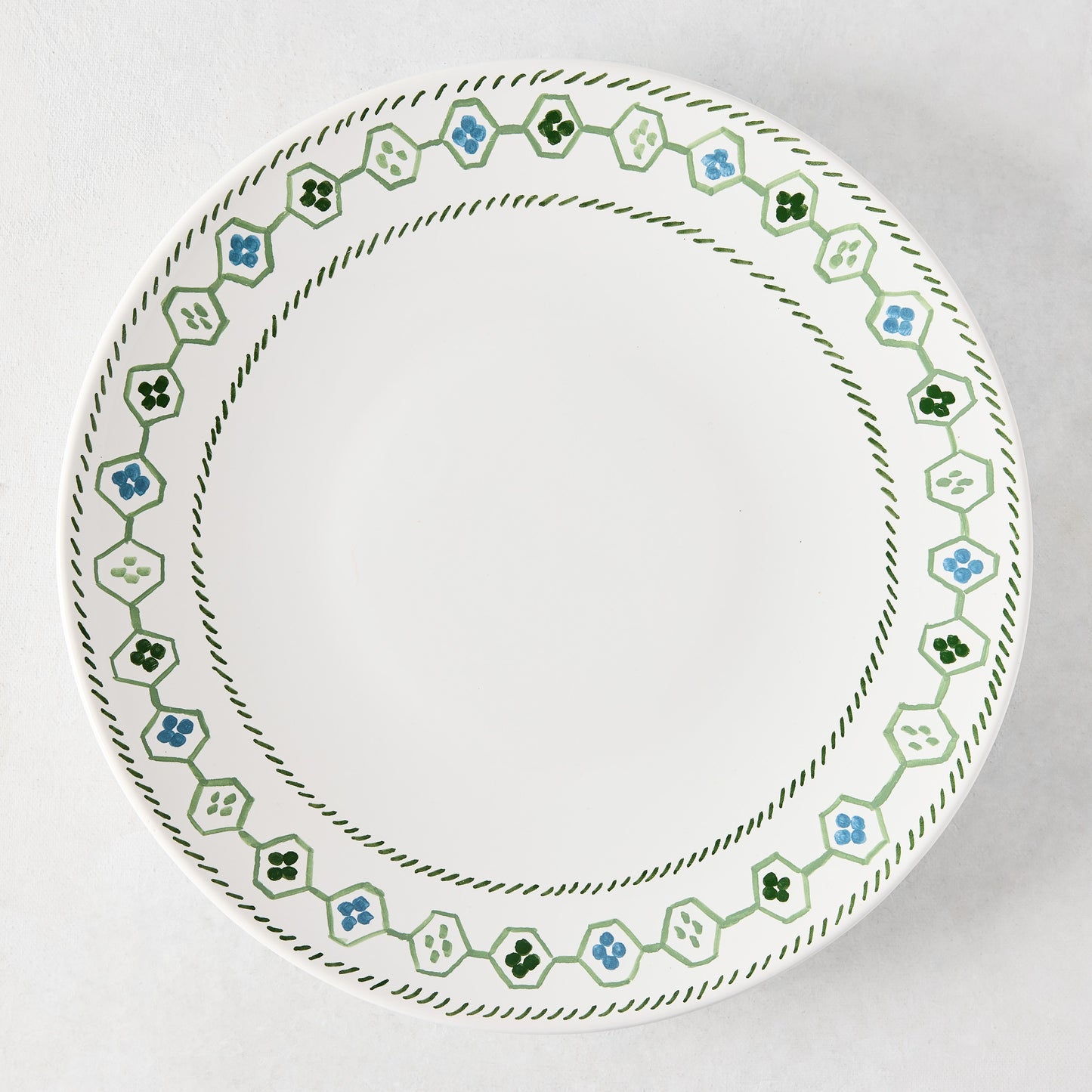 Peter Dunham + Hudson Grace Hand-Painted Green Oona Border Dinner Plate, white ceramic with tribal motif.