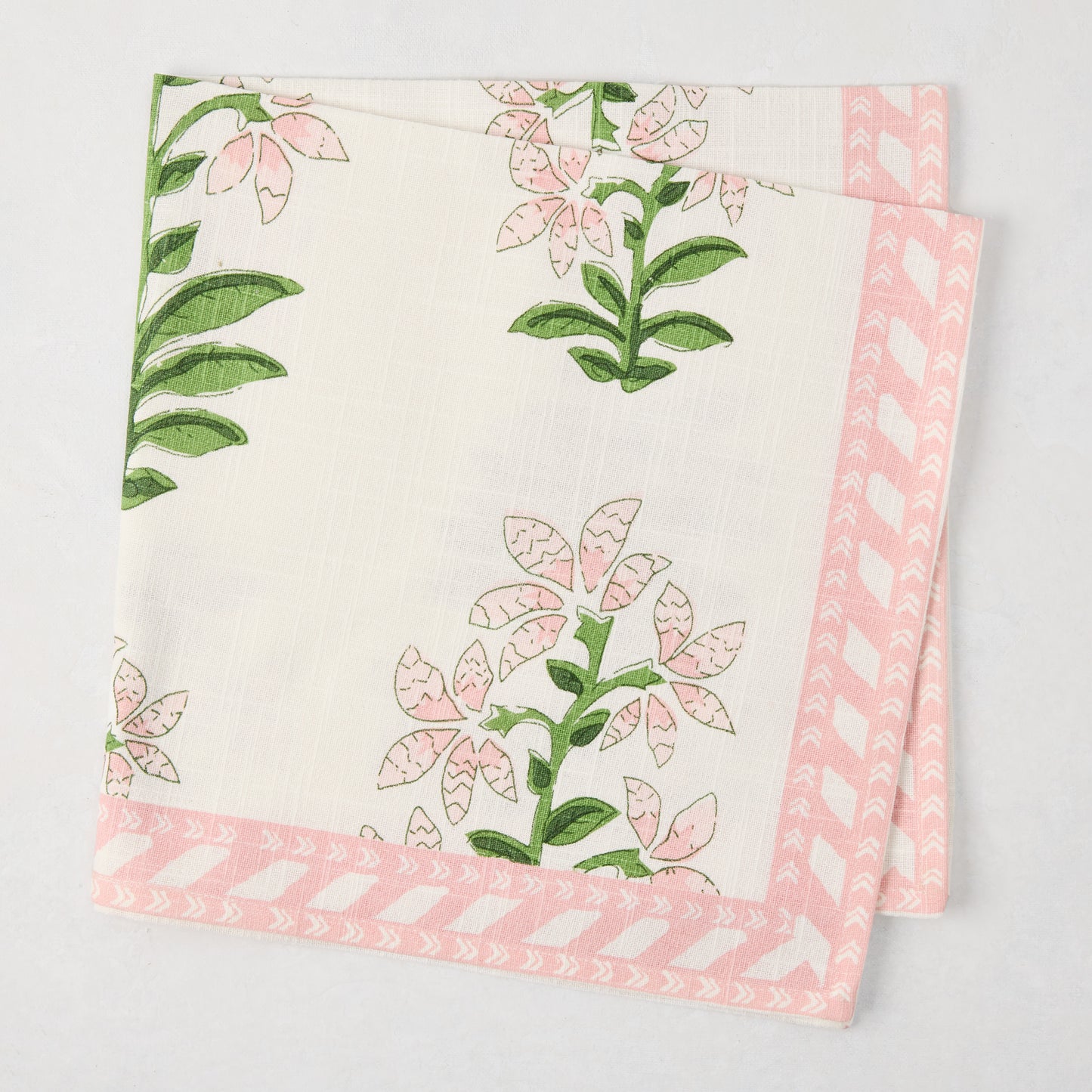 Peter Dunham + Hudson Grace Pink Shani Floral Printed Napkin, 100% cotton slub with pink botanical pattern and border.