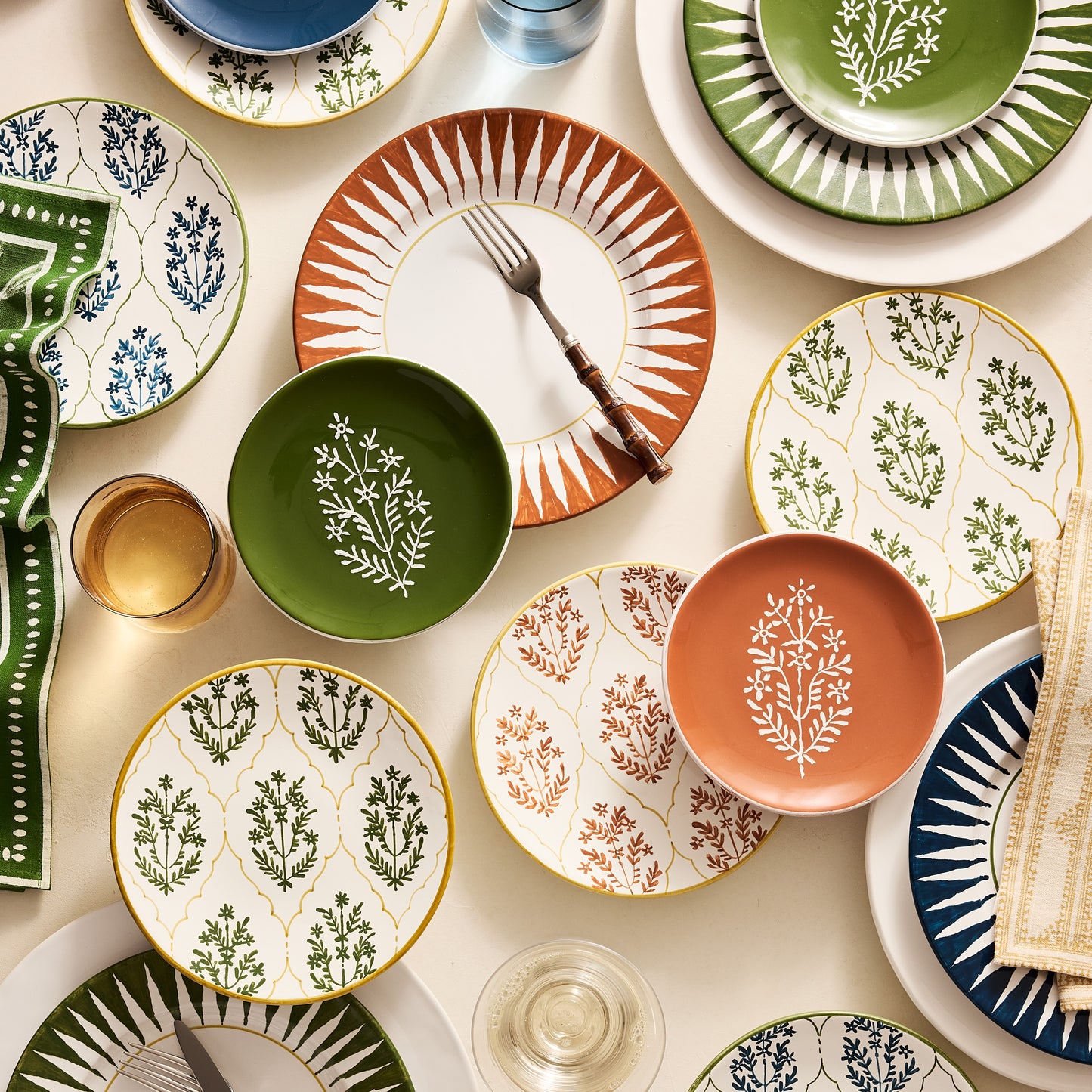 Peter Dunham + Hudson Grace Spice Orange Hand-Painted Jaali Salad Plate with green border and floral pattern.