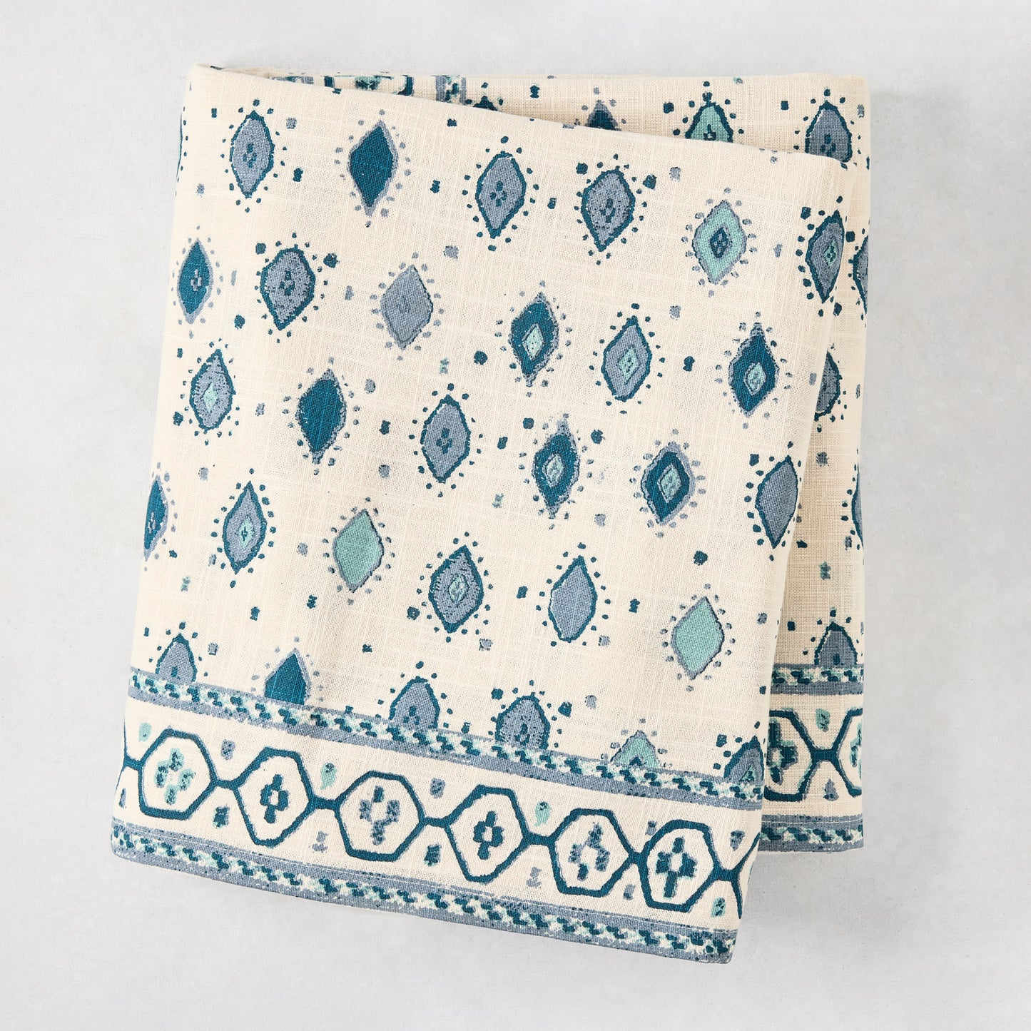 Peter Dunham x Hudson Grace Blue Oona Printed Tablecloth, ivory cotton slub with tribal blue pattern and bold border.
