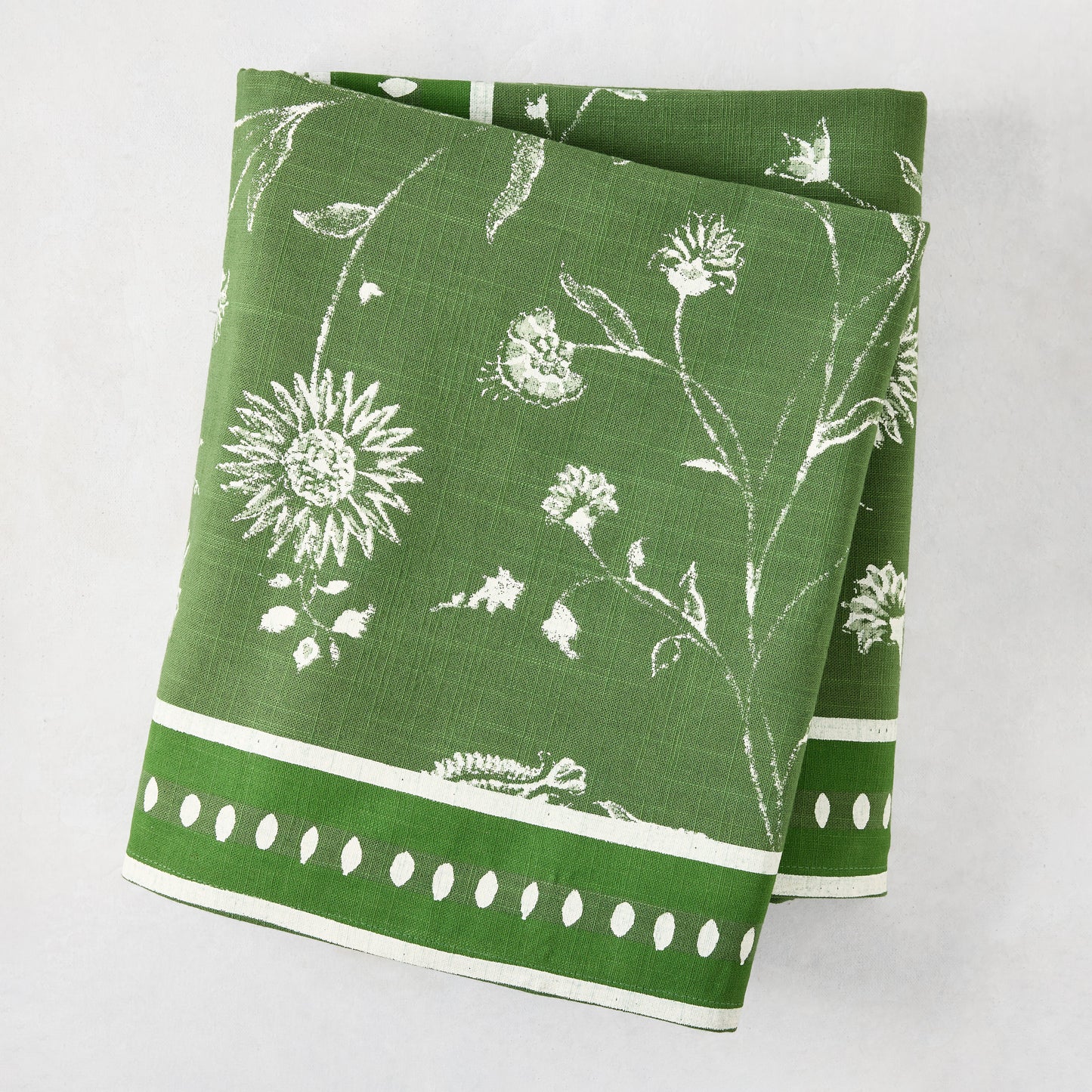 Peter Dunham x Hudson Grace olive green Indian chintz floral printed cotton tablecloth, folded.