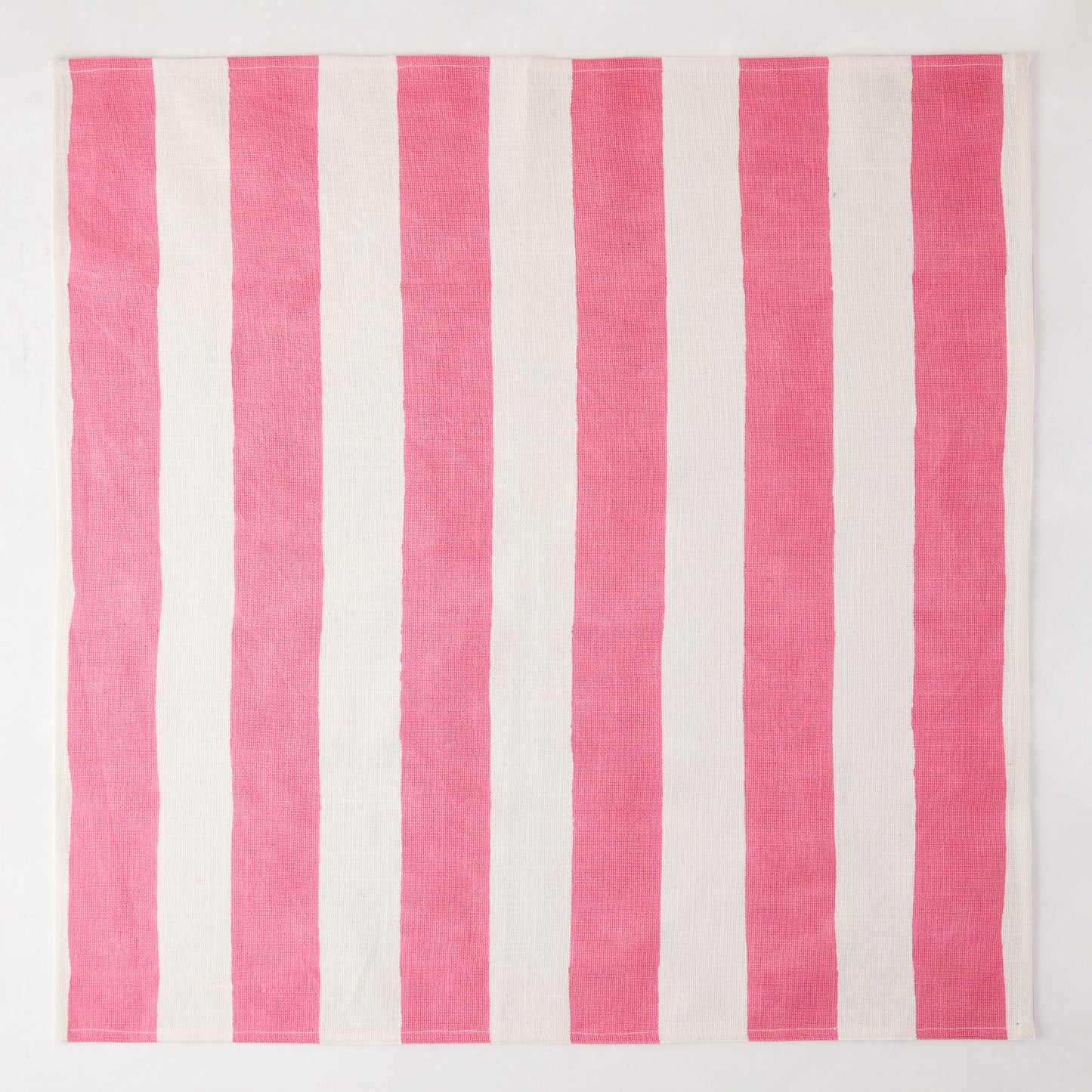 Pink Hampton Stripe Cotton Napkin, 22" square, with bold pink and white vertical stripes.