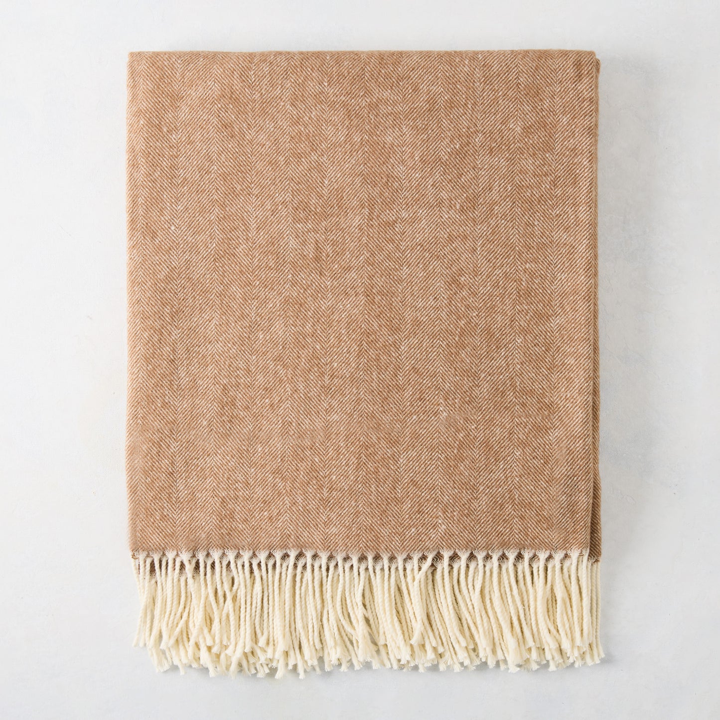 Saddle brown Italian herringbone throw blanket with decorative cream fringe, 51"W x 67"L.