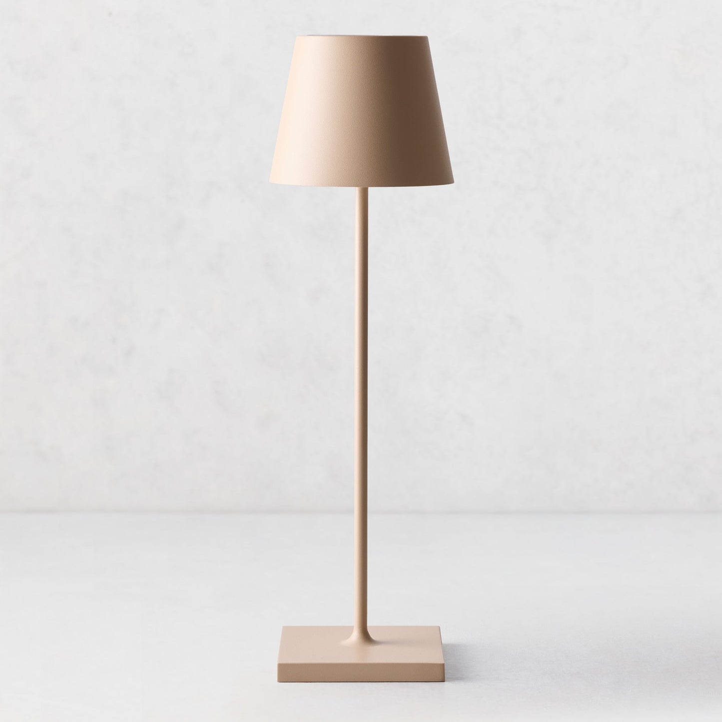 Hudson Grace Sand Poldina Pro rechargeable LED lamp with a sleek, minimalist design and durable powdercoat finish.