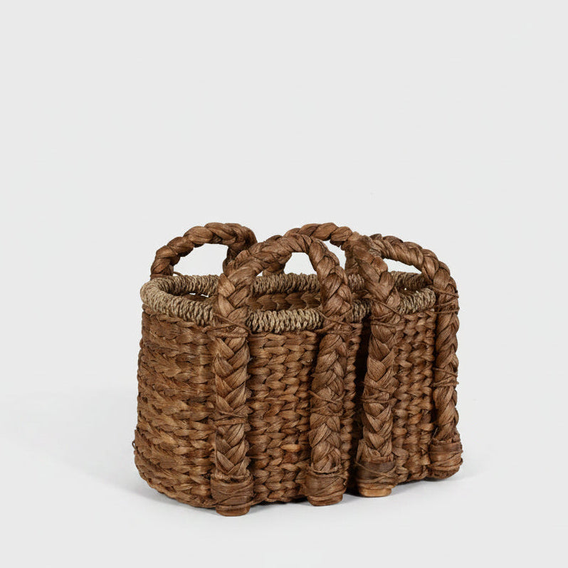 Small rectangular woven water hyacinth basket with braided handles.