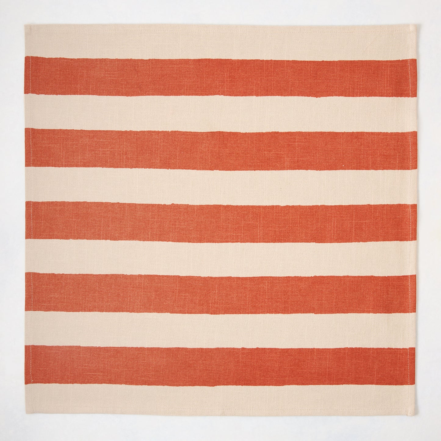 Spice Orange Hampton Stripe Natural Cotton Napkin, 22" square, with wide orange stripes on a khaki base.