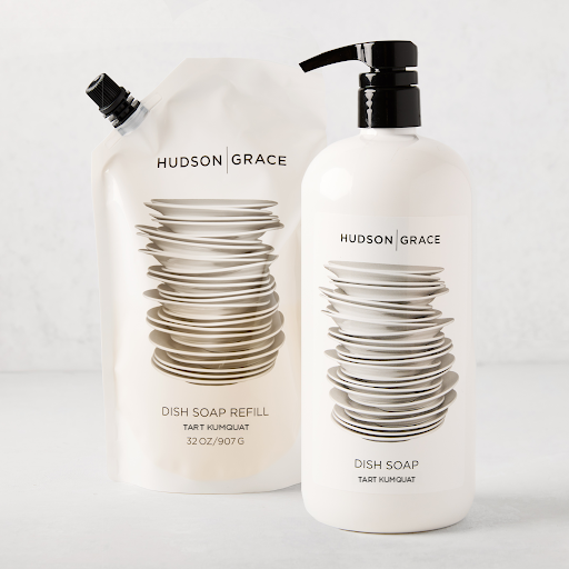 Hudson Grace Tart Kumquat dish soap gift set: white pump bottle and refill pouch with stacked plates design.