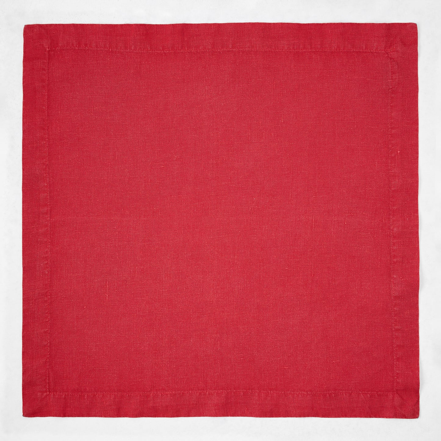 Flame red 22-inch square hand-dyed linen napkin with mitered corners.