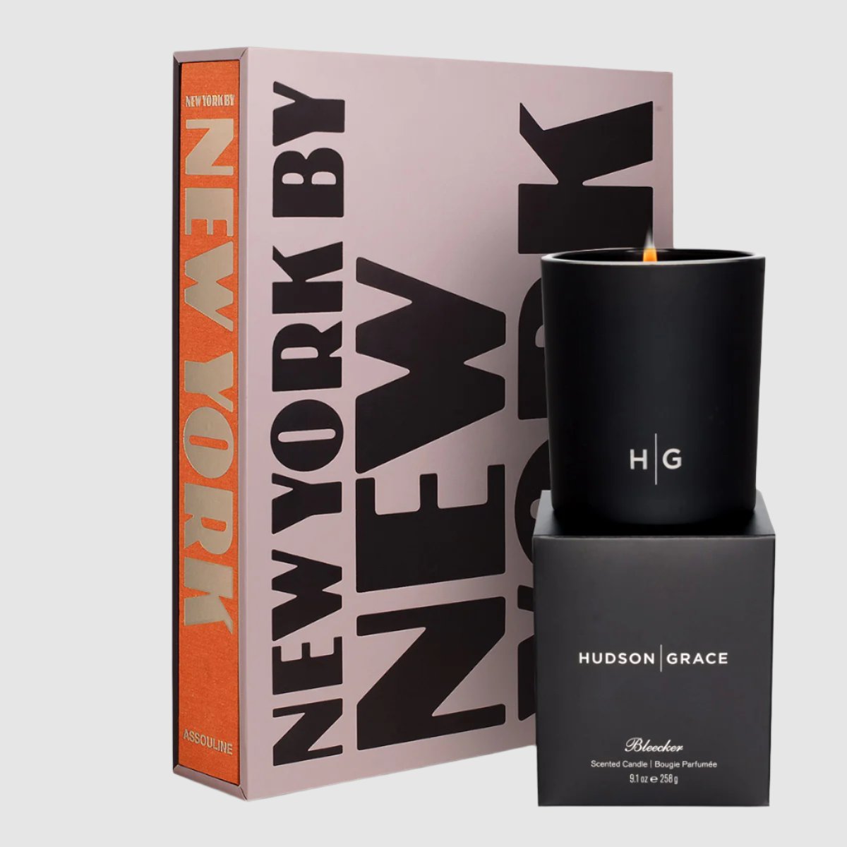 Ultimate New York Gift Set: Assouline's New York by New York book with orange spine and black Bleecker candle.