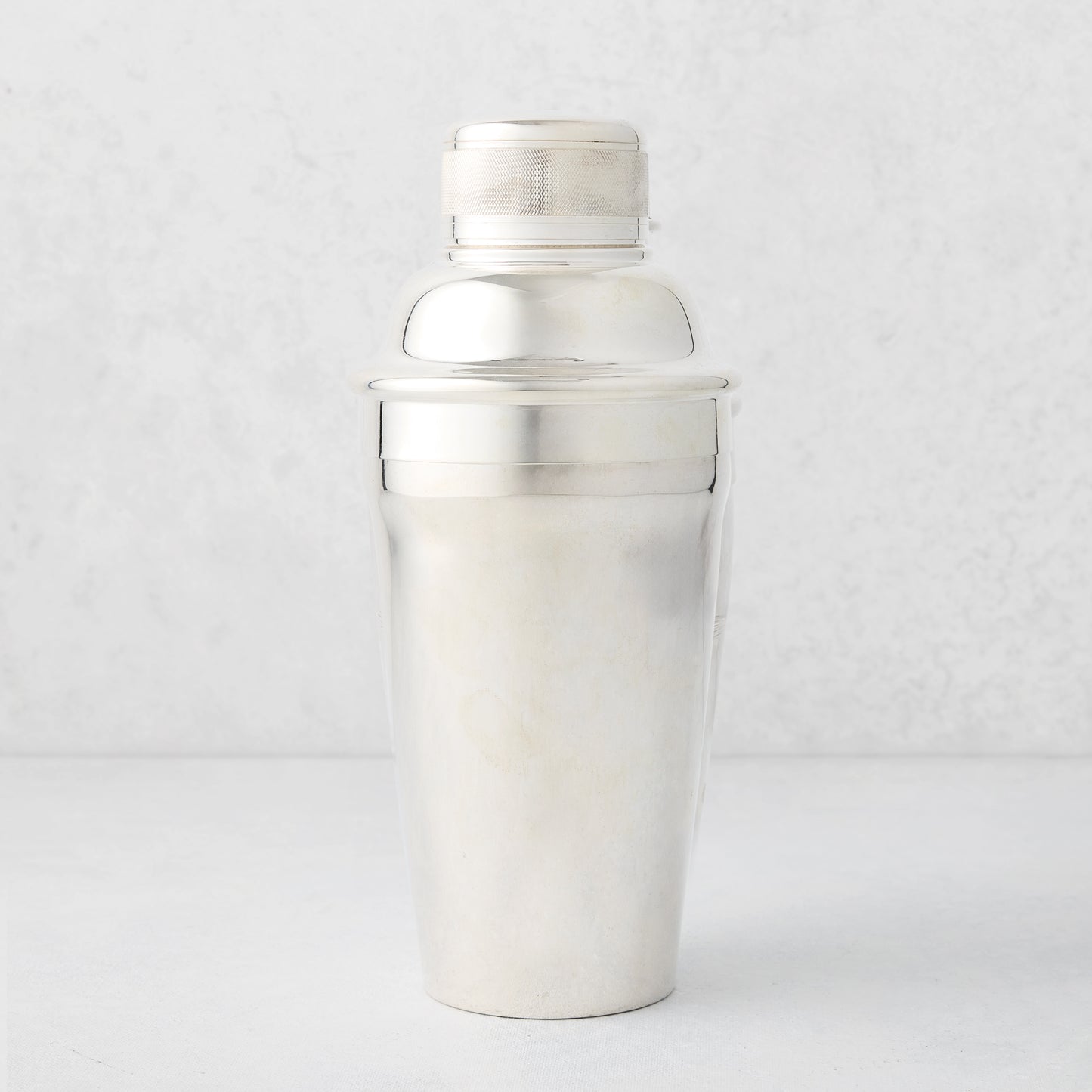 Vintage silverplate Carrie cocktail shaker with ribbed cap.