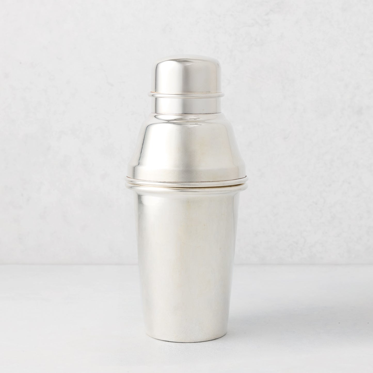 Vintage silverplate Celine cocktail shaker with a polished finish.