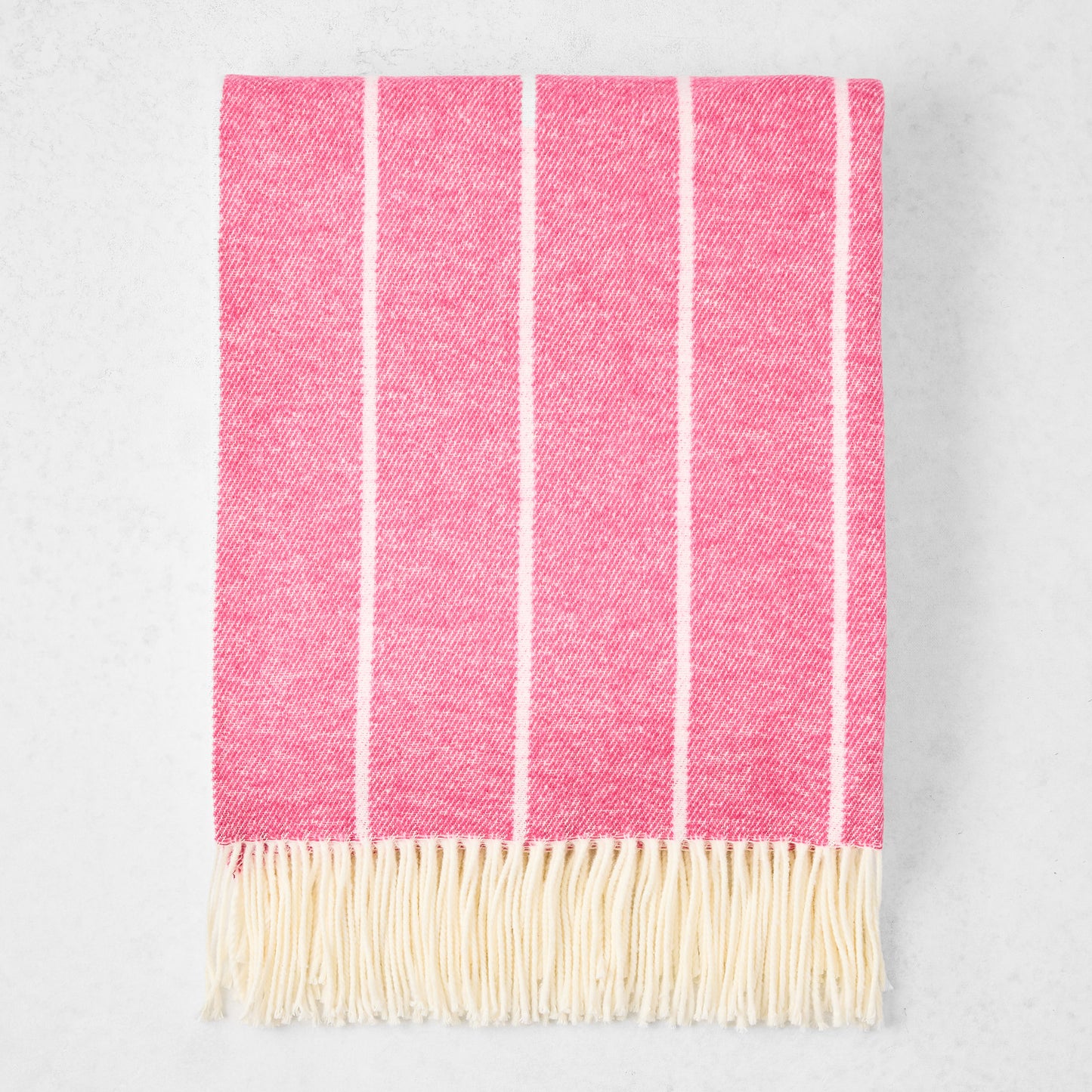 Wild Orchid Pink Fiji Stripe Throw Blanket, 51"W x 67"L, cotton-acrylic blend with fringe.