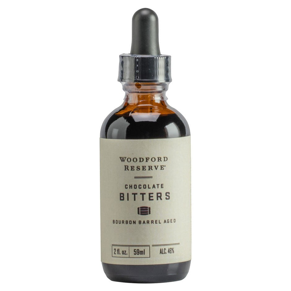 Woodford Reserve Chocolate Bitters in a small amber glass bottle with a black dropper cap and cream label.