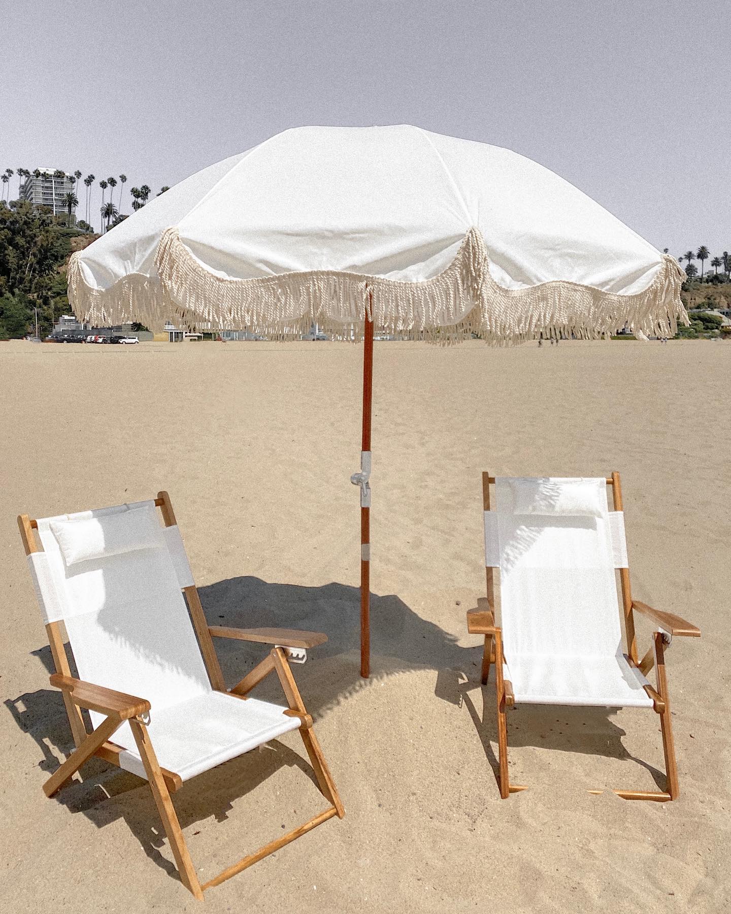 white canvas reclining beach chair with pillow