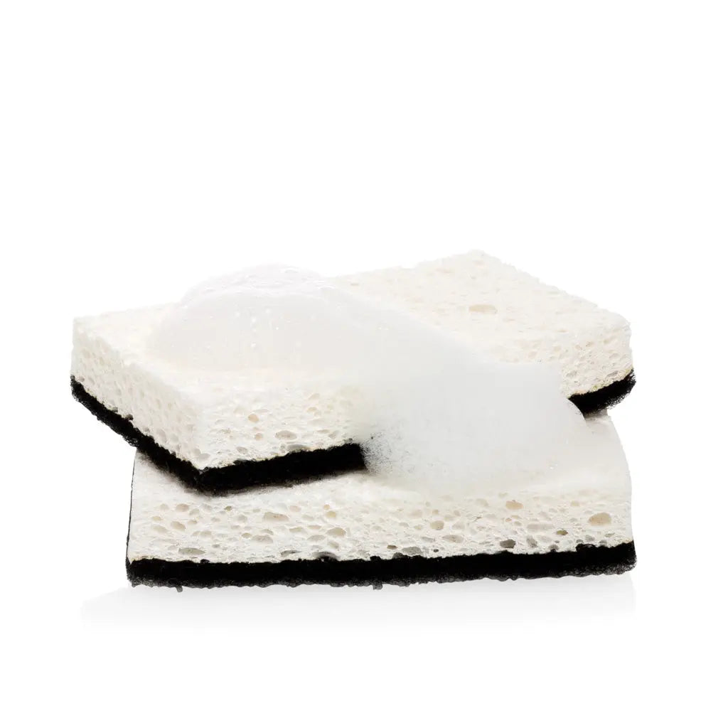 Set of 2 black and white kitchen sponges with a non-scratch scourer, one with soap suds.